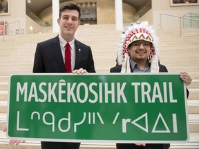 Edmonton Mayor Don Iveson and Enoch Cree Nation Chief Billy Morin mark the official announcement of the renaming of 23 Avenue between 215 Street and Anthony Henday to Maskekosihk Trail, during a press conference at Edmonton's city hall on Feb. 12, 2016.
