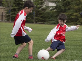 Gabe Woodall (left) and Callen Woodall play soccer in Const. Dan Woodall Park, 7304 South Terwillegar Drive. The park was officially dedicated Wednesday to the constable who was slain in the line of duty June 8, 2015.