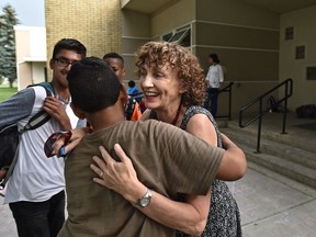 Elisabeth Thomsen, principal of Mount Pleasant school, gets hugs from students on her last day on Tuesday, June 28, 2016, after 25 years as an educator.