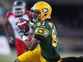 Edmonton Eskimos' Derel Walker runs with the ball during first half CFL West Division final football action against the Calgary Stampeders in Edmonton, Sunday, Nov. 22, 2015. Walker faces sky-high expectations in 2016, but fortunately he knows a little bit about pressure.THE CANADIAN PRESS/Jeff McIntosh ORG XMIT: CPT103