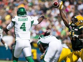 Edmonton Eskimos defensive end Odell Willis , right,tries to block the throw from Saskatchewan Roughriders quarterback Darian Durant during pre--season CFL action at The Brick Field at Commonwealth Stadium on June 18 2016  in Edmonton.