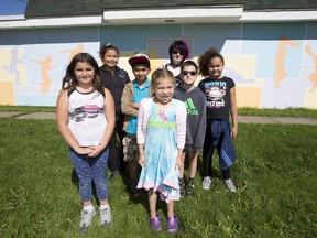 Edmonton school children, Katelin Mercer , Jada Prince,  Fahad Khan,  Myeisha Smith, Remmi Russell,  Damien Woodman and Alicia Rohlehr banded together to cover graffiti on the Inglewood Community League building with a mural.