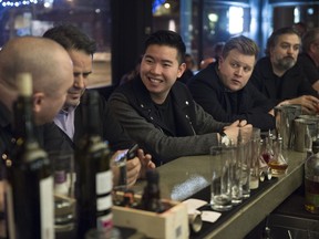 Kevin Cam (centre), seen in this photo at his first restaurant, North 53, is opening a second concept in Edmonton.