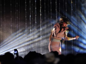 Vocalist Megan James of Purity Ring performs in Winston Churchill Square in Edmonton on June 13, 2015.