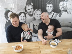 Daniel Costa (left) with his son, Gennaro, sits alongside Dani Braun and his son, Max.