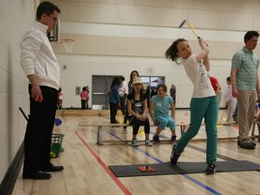 Students at Monsignor Fee Otterson school learn golf under the watchful eye of local pro Landon Hargreaves in this 2011 photo. The national Golf in Schools programs has more than 100 Edmonton area schools participating.