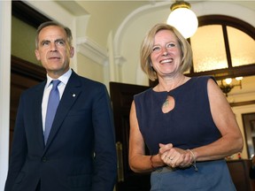 Bank of England Gov. Mark Carney and Premier Rachel Notley speak with the news media at the Alberta legislature on June 6, 2016.