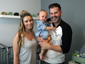 Eleven-month old Wyatt Jespersen, with his mom Kari Skelton and dad Ryan Jespersen on June 7, 2016. They hired a sleep coach for their son Wyatt and are very glad they did.