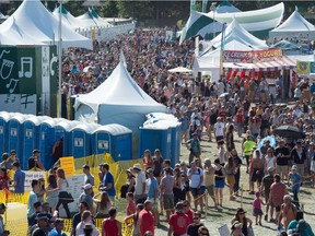 The lineup for beer and food vendors at the Edmonton Folk Music Festival in August 2015. Producer Terry Wickham says he is trying to reduce waits for a beer at the festival, but it likely won't be much quicker this year.