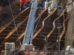 Steel beams buckled in March 2015 on the new 102 Avenue bridge over Groat Road, delaying the project by about 10 months.