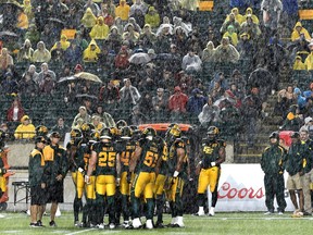 The rain comes pouring down at the Edmonton Eskimos vs Calgary Stampeders game during CFL action at Commonwealth Stadium in Edmonton,  September 12, 2015.