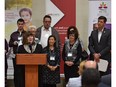 Co-chair Bishop Jane Alexander, at podium, of EndPovertyEdmonton, discusses the group's strategy to eliminate poverty in Edmonton within a generation in Edmonton, September 18, 2015.