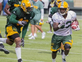 Edmonton Eskimos running back Shakir Bell, right, runs upfield with the ball while being pursued by linebacker Deon Lacey during practice at Commonwealth Stadium in Edmonton Alta. on Tuesday June 7, 2016. Robert Murray/Fort McMurray Today/Postmedia Network