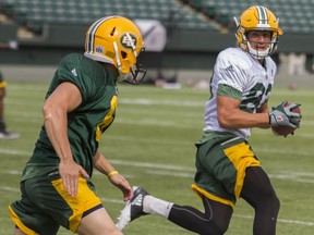 Edmonton Eskimos wide receiver Brandon Zylstra, right, checks his right side while running the ball upfield for  drill during practice at Commonwealth Stadium in Edmonton Alta. on Wednesday June 8, 2016.