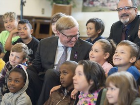 Alberta Education Minister David Eggen announced plans June 15, 2016, to begin redeveloping the province's future curriculum over the next six years. Here, he talks with the Grade 3 class from John A. McDougall School and Mark Ramsankar, president of the Alberta Teachers' Association.