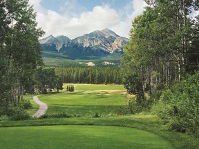 The par-3 ninth hole, known as Cleopatra, at the Fairmont Jasper Park Lodge, features Pyramid Mountain in the distance.