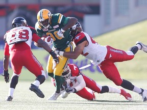 Edmonton Eskimos' Bryant Mitchell (80) is stopped during first half CFL pre-season action against the Calgary Stampeders in Calgary on June 11, 2016.