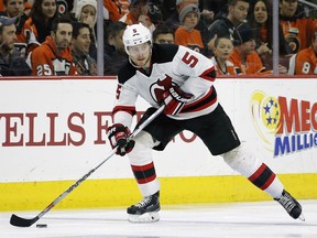 FILE - In this Feb. 13, 2016, file photo, New Jersey Devils' Adam Larsson moves the puck during an NHL hockey game against the Philadelphia Flyers in Philadelphia. The Devils have acquired former No. 1 overall draft pick Taylor Hall from the Edmonton Oilers for defenseman Adam Larsson. The teams announced the trade Wednesday, June 29, 2016, two days before the start of free agency.