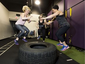 Jessica Zapata,  Lisa Martinuk and Alana Yim  prepare for Femsport at Infinite Fitness in Edmonton.