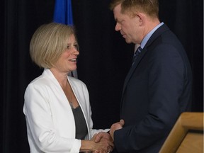Premier Rachel Notley shakes hands with Leader of the opposition and Wildrose MLA for Fort McMurray-Conklin Brian Jean, during a press conference at the Provincial Operations Centre, 14515 - 122 Ave., in Edmonton Alta. on Wednesday May 18, 2016.