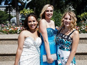 (From left) Keandra Bourgeois, Victoria Whitehead and Shay Grundberg pose for a photo during the J. Percy Page High School pre-graduation at the Alberta Legislature grounds.