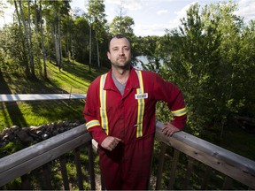 Rheimer Reid talks about why he stayed at his home in Gregoire Lake Estates during the fire to help protect his home as well as his neighbours in the subdivision. (Greg Southam-Edmonton Journal)