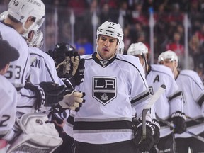 Milan Lucic of the Los Angeles Kings celebrates with the bench after scoring against the Calgary Flames during an NHL game at Scotiabank Saddledome on April 5, 2016 in Calgary, Alberta, Canada.