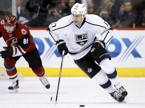 FILE- In this Feb. 2, 2016, file photo, Los Angeles Kings' Milan Lucic (17) skates with the puck during an NHL hockey game in Glendale, Ariz. The New Jersey Devils have acquired former No. 1 overall draft pick Taylor Hall from the Edmonton Oilers for defenseman Adam Larsson, which the teams announced Wednesday, June 29, 2016, two days before the start of free agency. The Oliers get salary cap space to possibly sign free agent Lucic with Hall's $6 million annual salary heading to New Jersey.