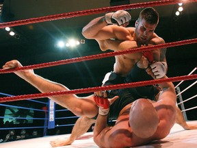 Feb. 3, 2007: Adam Braidwood (on top), a member of the Canadian Football League's Edmonton Eskimos, defeated Ryan Jimmo in a Maximum Fighting Championship mixed martial arts fight held at Shaw Conference Centre in Edmonton.