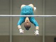 EDMONTON, AB.; JUNE 1, 2016 -- Ellie Black of Team Nova Scotia on the uneven bars during pre-competition warm-up at the UofA in Edmonton June 1, 2016.  (Dan Riedlhuber/Postmedia News)  For Jason Hills (Postmedia News) NATIONAL GYMNASTICS CHAMPIONSHIP ORG XMIT: NationalGymnasticsChampionship05