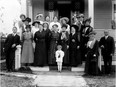 There's a lot going on behind this group photo of suffragists snapped 100 years ago outside Nellie McClung's Edmonton home, writes University of Alberta professor Sarah Carter.
