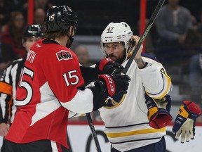The Ottawa Senators took on the Buffalo Sabres at the Canadian Tire Centre in Ottawa Ontario Tuesday Jan 26, 2016. Senators Zack Smith fights Sabres Zach Bogosian during first period action Tuesday.   Tony Caldwell/Postmedia Network