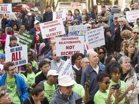 A throng of hundreds gathers during an anti-Bill 10 rally outside of the McDougall Centre at  in Calgary on May 14.