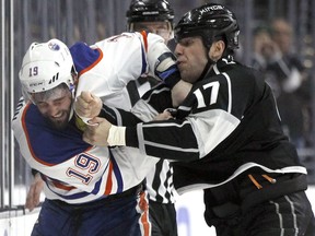 Edmonton Oilers left wing Patrick Maroon (19) and Los Angeles Kings left wing Milan Lucic (17) fight during the second period of an NHL hockey game in Los Angeles, Saturday, March 26, 2016.