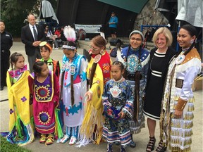 Premier Rachel Notley has photos taken with powwow dancers at a National Aboriginal Day ceremony just outside the Borden Park Bandshell in Edmonton on Tuesday, June 21, 2016.