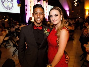 Riley Gomes, left, and Patrycja Jucha at  Archbishop MacDonald High School's 2016 graduation at the Shaw Conference Centre.