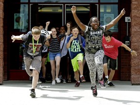 Students at Archbishop Joseph McNeil School in Edmonton exit the school as the final buzzer signals the end of classes for the summer on June 28, 2016. A Journal letter writer says educators deserve thanks for their dedication.