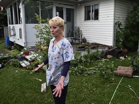 Shelley Dedio's home took the brunt of the severe weather caused by a possible tornado which caused damaged to homes and trees as flying debrie damaged neighbouring homes in Ponoka, Friday, June 30, 2016. Ed Kaiser/Postmedia