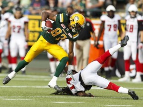 Edmonton's Derel Walker (87) pushes Ottawa's Abdul Kanneh (14) away during a CFL game between the Edmonton Eskimos and the Ottawa Redblacks at the Brick Field at Commonwealth Stadium in Edmonton on Saturday, June 25, 2016. Ian Kucerak / Postmedia