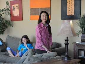 Nhung Tran-Davies, shown here in 2014, has  been collecting signatures on a math petition to change the math curriculum for children.  After learning vertical addition methods at home, her daughter Kenya was turned off by how math was taught in school.