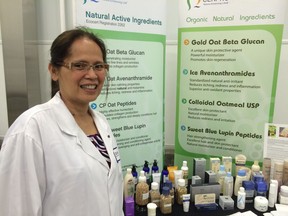 Leoni Dejoya, production manager of Ceapro Inc., shows off the biotechnology company's products Tuesday at Leduc's Agrivalue Processing Business Incubator and Food Processing Development Centre.