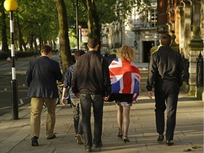 Vote Leave supporters walk along a street in central London, on June 24, 2016. Britain entered uncharted waters Friday after the country voted to leave the European Union.