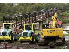 The Cloverdale footbridge behind construction equipment parked in Louise McKinney Riverfront Park in Edmonton on Sunday, July 10, 2016.