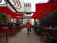 The rooftop patio at Edmonton's Craft Beer Market is a cheery red oasis above Rice Howard Way.