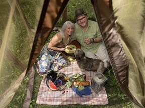 Susie Moloney, Vern Thiessen and their dog Scrappy pose for a photo in their Edmonton backyard on July 22, 2016.