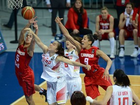 ISTANBUL, TURKEY -  OCTOBER 5:  Xiaojia Chen of China is in action with Canada's Courtnay Pilypaitis during the 2014 FIBA Women's World Championships 5th place basketball match between China and Canada at Fenerbahce Ulker Sports Arena on October 5, 2014 in Istanbul, Turkey.