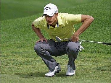 Aaron Wise of Lake Elsinore, Calif., lines up a putt at the Syncrude Oil Country Championship held at the Glendale Golf & Country Club in Edmonton on July 31, 2016.