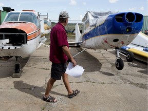 Deryl Kartz checks out items up for sale at the Alberta Aviation Museum's auction, in Edmonton on Friday July 15, 2016. The auction begins Saturday at 10 a.m. at the museum, 11410 Kingsway.