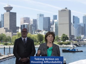 British Columbia Finance Minister Michael de Jong, left, and Premier Christy Clark announce 2016. Premier Clark announced in June that the government will end  self-regulation in the real estate industry.