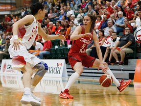 Canada's Kim Gaucher is hassled by China's Lu Wen during the Edmonton Grads International Classic basketball game between Canada and China at the Saville Community Sports Centre in Edmonton, Alta., on Monday, July 11, 2016. Codie McLachlan/Postmedia For Jason Hills story running in Tuesday's edition, sports.